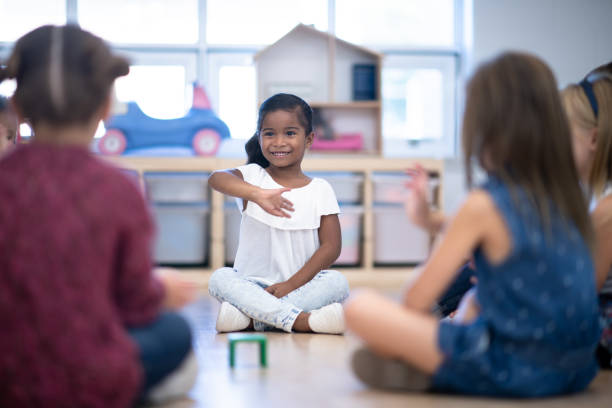 istock Kindergarten Class Singing and Clapping During Circle Time stock photo 1199489147