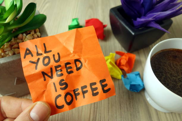 istock Slogan all you need is coffee handwritten on sticky note 1199489903