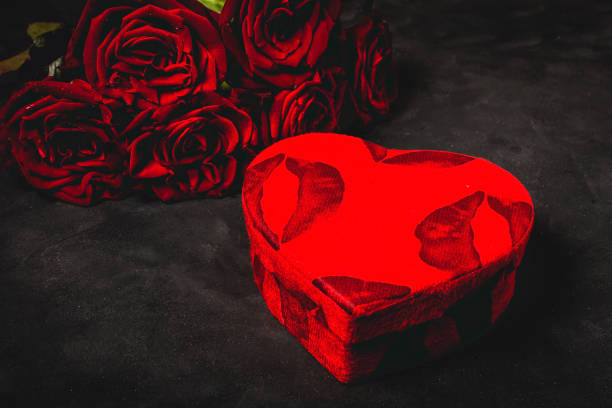 istock Composition of red roses and gift boxes 1199489934