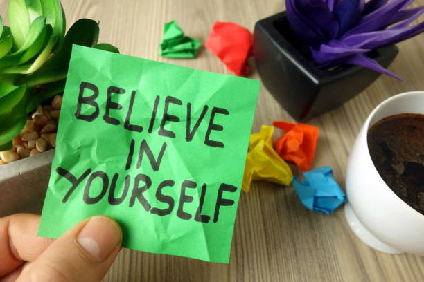 istock Slogan believe in yourself handwritten on sticky note 1199490243