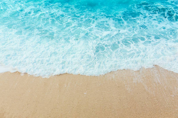 Soft beautiful ocean wave on sandy beach. Background. stock photo