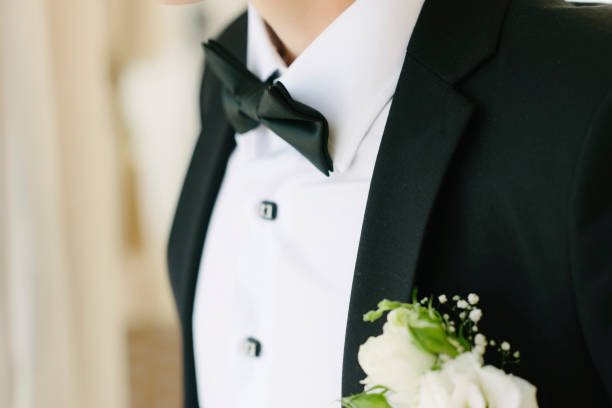 istock A man in a suit straightens a butterfly on 1199493571