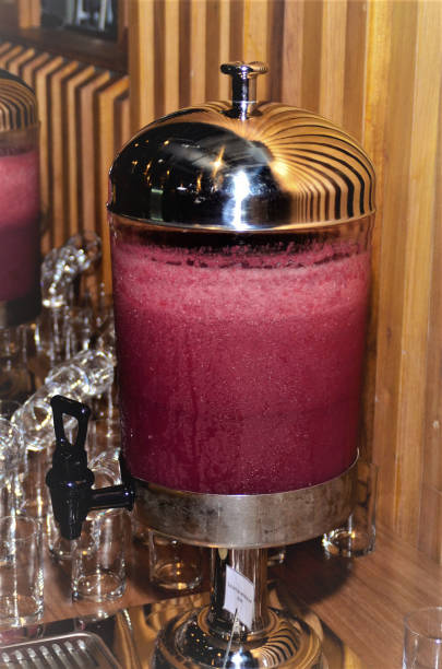 istock Red fruit juice in milkon desk 1199497566