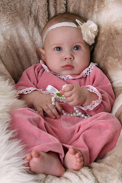 istock Beautiful little baby with pearls 119949952