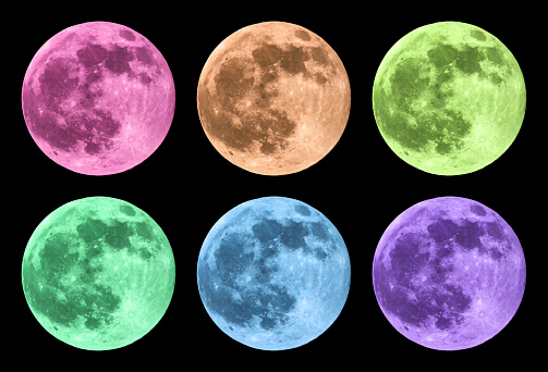 Full moon in six colors in front of black background.