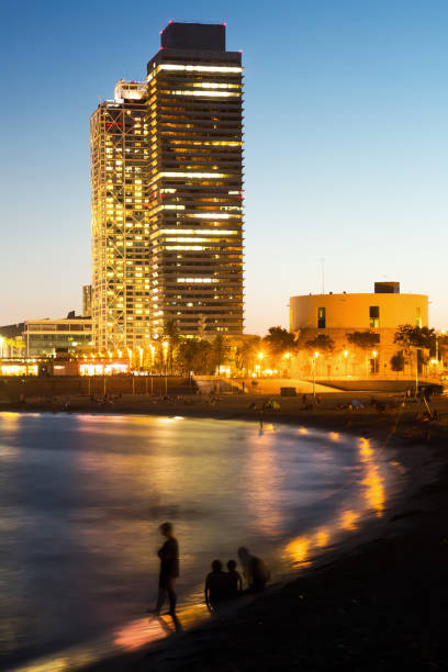 istock Illuminated Barceloneta Beach in summer night 1199500034