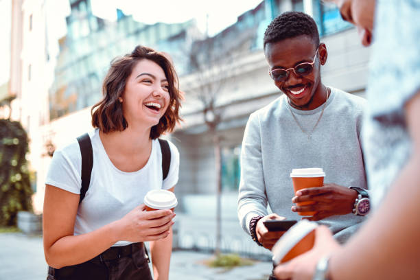 istock Multi Ethnic Friends Having A Few Laughs With Coffee After School 1199501538