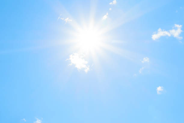 istock Bright sun with beautiful beams in the sky with clouds 1199505803