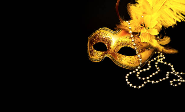 istock Golden Carnival mask on black background with silver beads. Mardi Gras concept. Copy space 1199507869