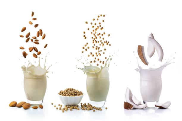 vegetable drinks alternative to animal milk isolated from the white background, some lively vegetarian and organic drinks, with coconut, soy and almonds, alternatives to animal milk coconut milk stock pictures, royalty-free photos & images