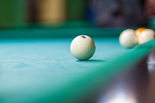istock white billiard ball on the table, billiard club 1199510917