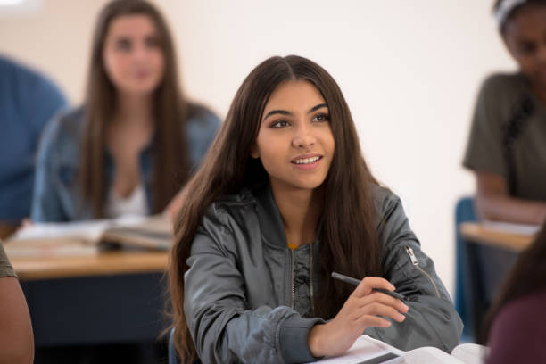 istock Hispanic University Student Sitting in Class stock photo 1199515371