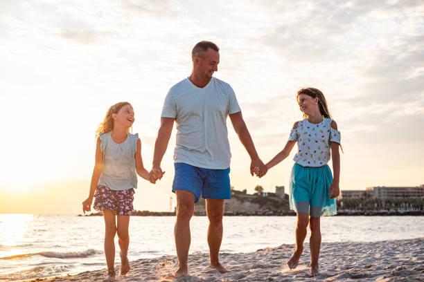 istock Family on the beach 1199517416