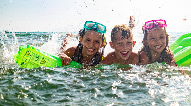 istock Kids in sea 1199517486