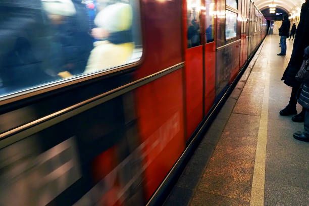 istock Metro train pulls up to the station, metro passengers, subway, underground 1199520191