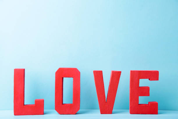 istock Red letters love on blue background. LOVE word. 1199520283