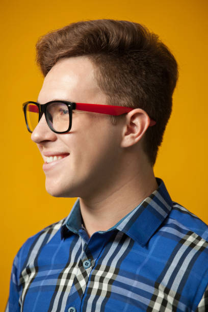 red- haired hipster talking to camera adjusting glasses gesture
