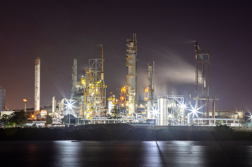 An industrial plant at night.