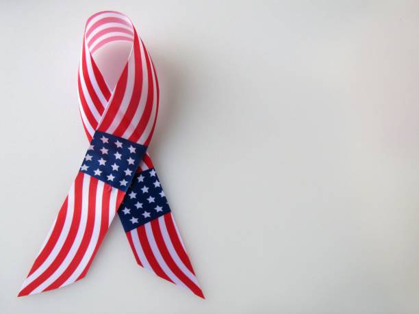 istock US flag ribbon, white background, copy space 1199534602