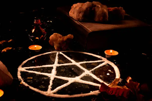 The Wiccan community uses pentagrams formed out of salt as a symbol of protection.  It is often accompanied by candles, herbs, spices and other plants.