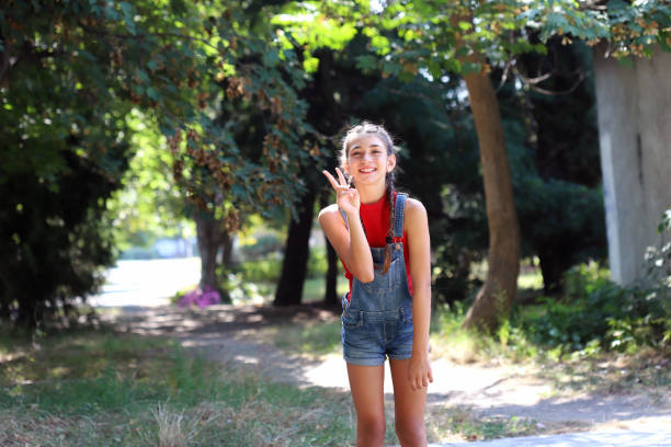 Happy young girl having fun in the nature