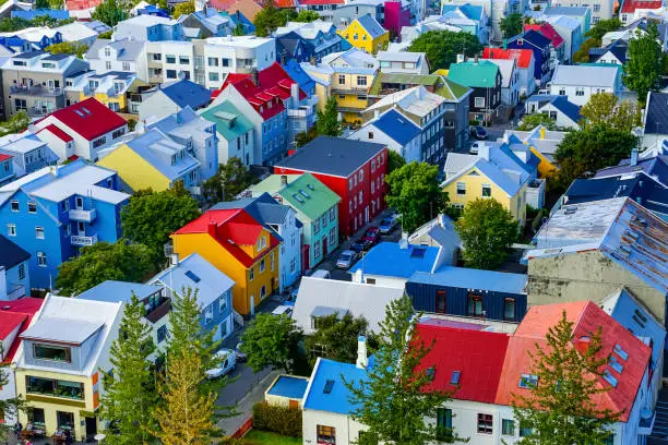 Colorful Red Green Blue Yellow Houses Cars Streets Reykjavik Iceland.  Most houses are made of corrugated metal.