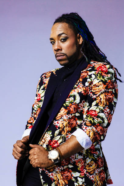 istock Studio portrait of a man wearing a flower patterned suit and dreadlocks 1199537298