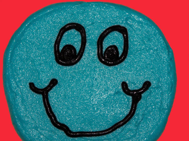 Big googly eyes and a smiling mouth are featured in this fun and silly image. The face is blue.