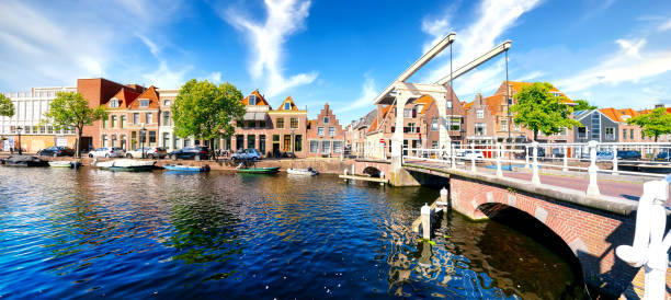 Alkmaar, Netherlands, 06/21/2019: Historic old town of Alkmaar, North Holland, with typical canal houses and draw bridge stock photo