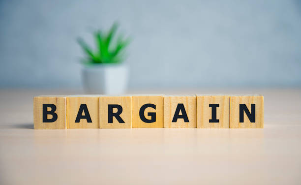istock Text bargain on wooden cubes blue background. business concept. 1199543804