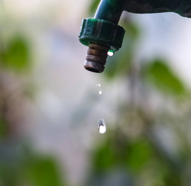 istock Small stream of water flowing slowly from a single tap 1199545806