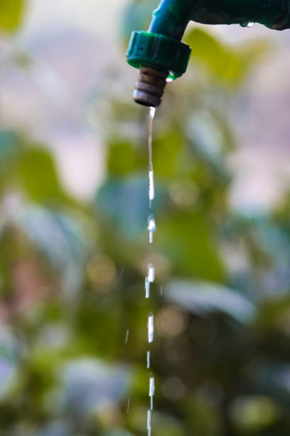 istock Small stream of water flowing slowly from a single tap 1199545835