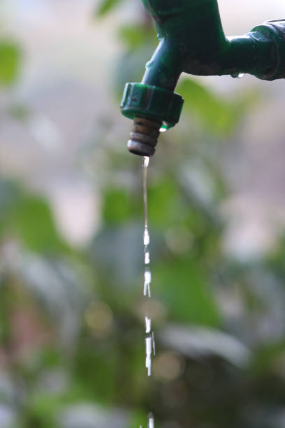 istock Small stream of water flowing slowly from a single tap 1199545847