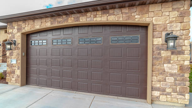 istock Panorama frame Large closed double wooden garage door day light 1199550266