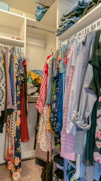 istock Vertical Clothing hanging up in a walk-in closet 1199551058
