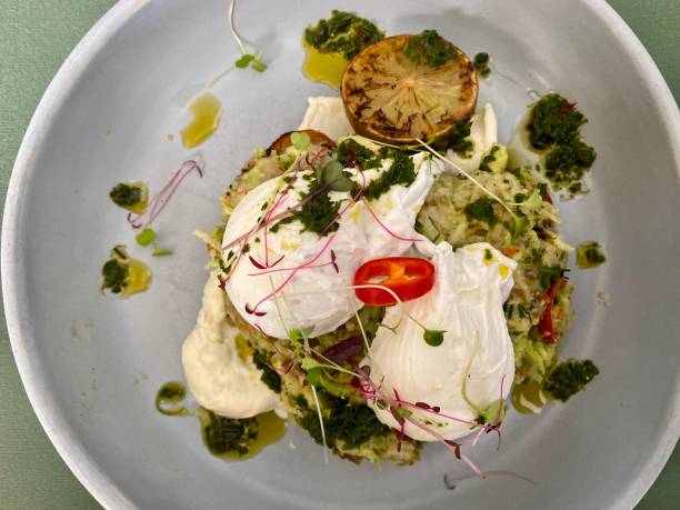 istock Poached Eggs and Smashed Avocado on Sourdough Toast 1199551145