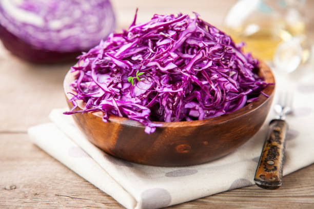 istock Red cabbage salad in a bowl on a table. Selective focus. Copy space. 1199553167
