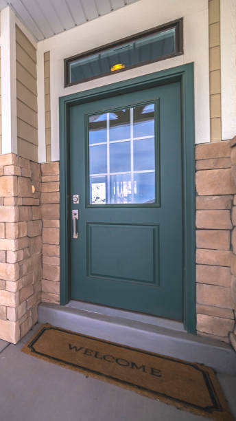 istock Vertical frame Wooden front door with glass centre pane 1199553382
