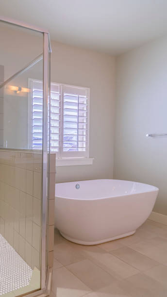 istock Vertical Spacious modern upmarket bathroom interior bright interior 1199554333