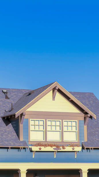 istock Vertical Large triple dormer window in an urban house 1199554975