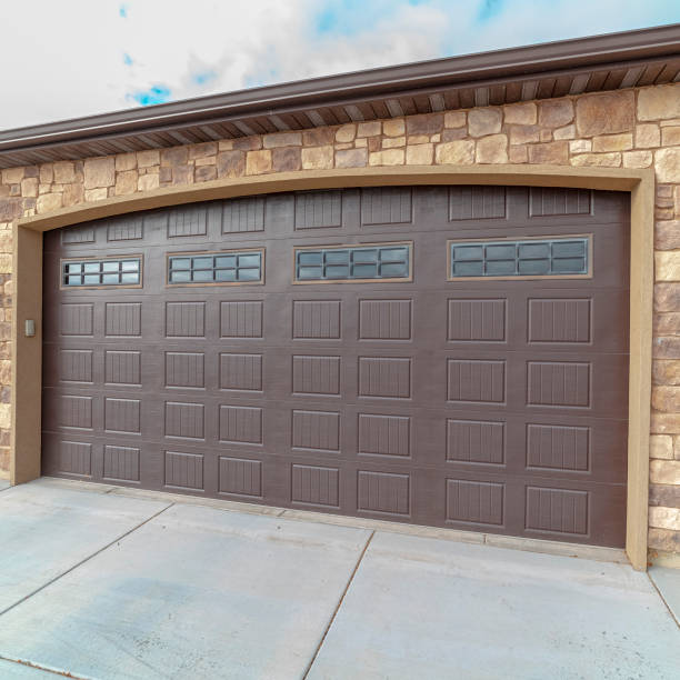 istock Square frame Large closed double wooden garage door day light 1199555184