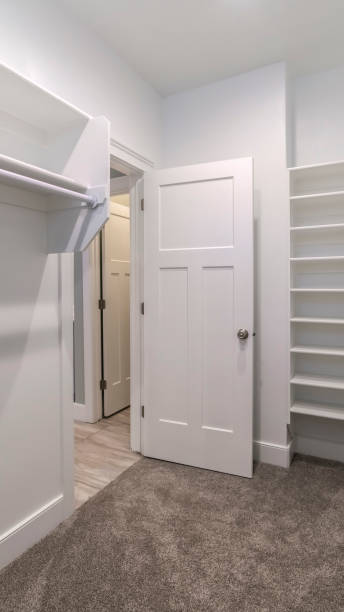 istock Vertical Interior of an empty walk-in closet or wardrobe 1199556171