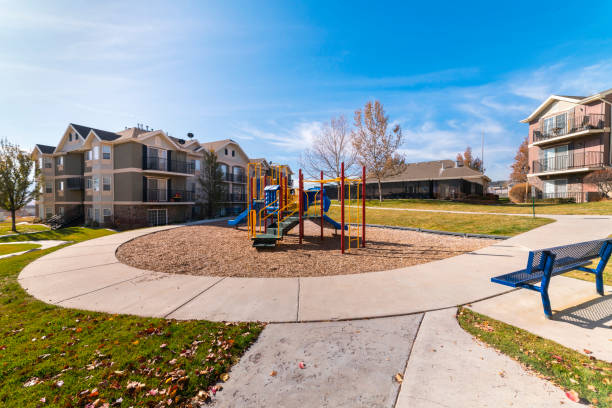 istock Winding paved footpath in a park day light 1199556310