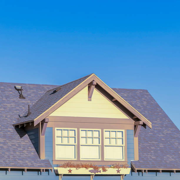 istock Square Large triple dormer window in an urban house 1199556313