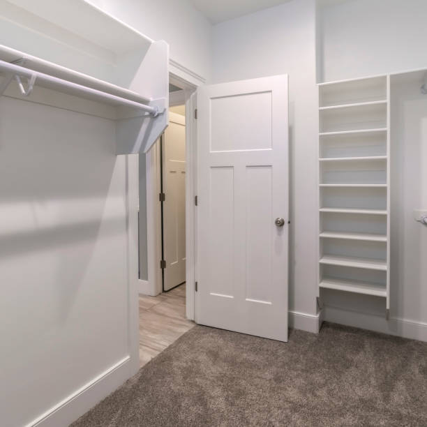 istock Square Interior of an empty walk-in closet or wardrobe 1199556349