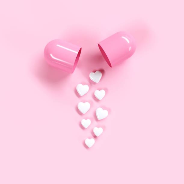 istock Pills heart concept idea on pink color background. Minimal valentine ideas. 3D Render. 1199568977