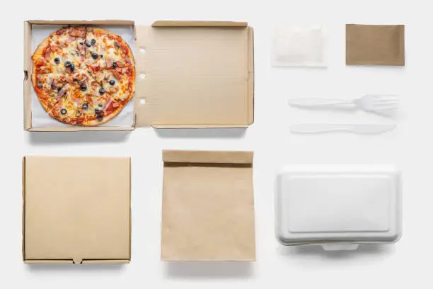 Photo of Concept of mock up pizza box set on white background. Copy space for text and logo. Set fast food.