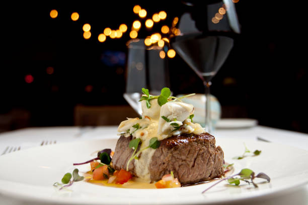 Filet Mignon Dinner Dish of filet mignon and vegetables with glass of red wine steak stock pictures, royalty-free photos & images