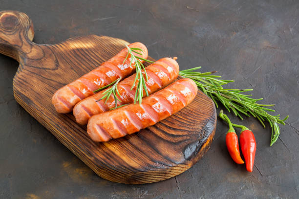 istock fried sausages with hot pepper and spices. 1199571890