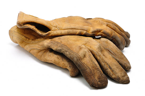 Heavily used leather work gloves stock photo